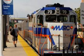 Passenger walks along MARC train platform