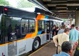 Passengers wait to board a MARTA bus