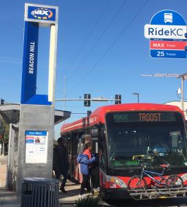 Passenger boards a Troost MAX bus in Kansas City